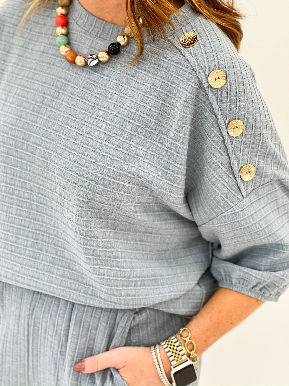 Blue pant set with a button trimmed top