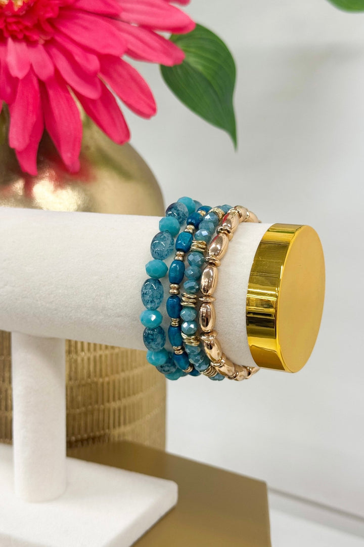 Four-row turquoise glass and wood bead bracelet