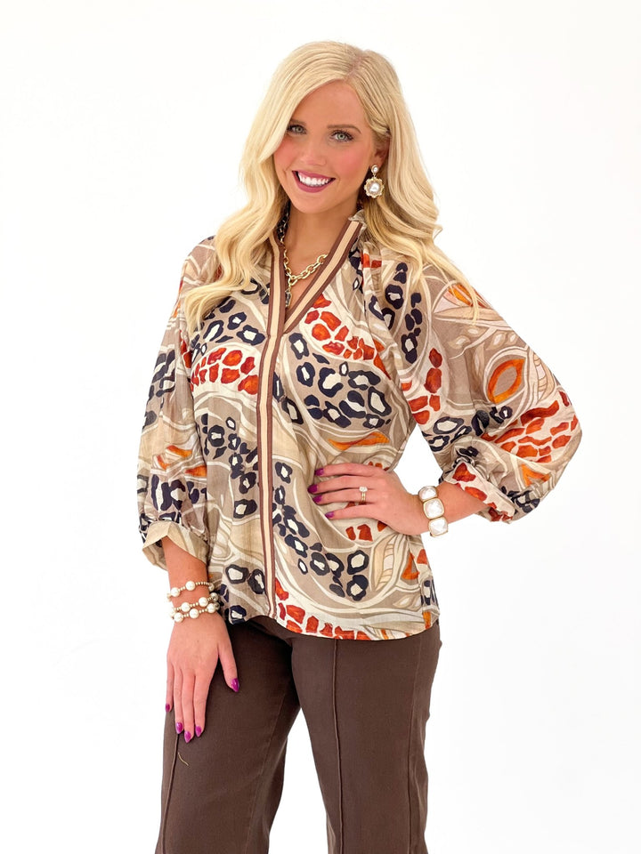 Mocha printed top with a smocked collar