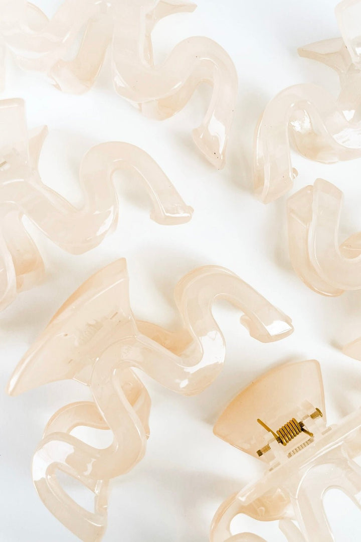Vanilla cream hair claw clip with a wavy shape