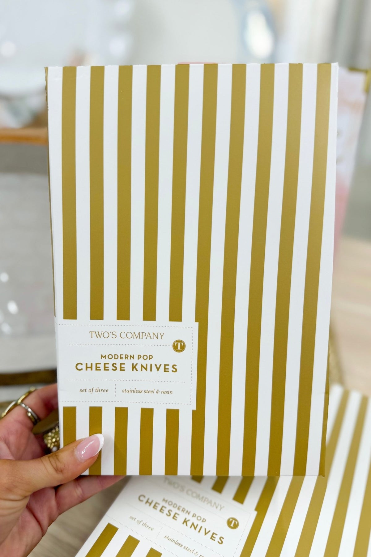 Set of cheese knives with white beaded handles in gift packaging