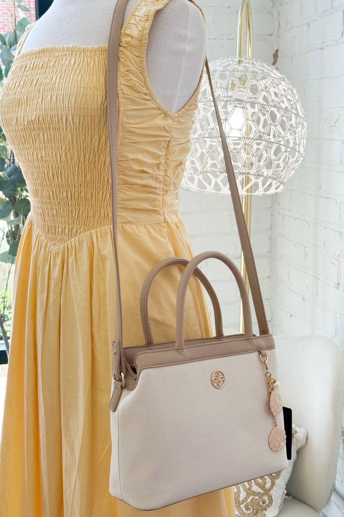 Compact vegan leather bag with a crossbody strap
