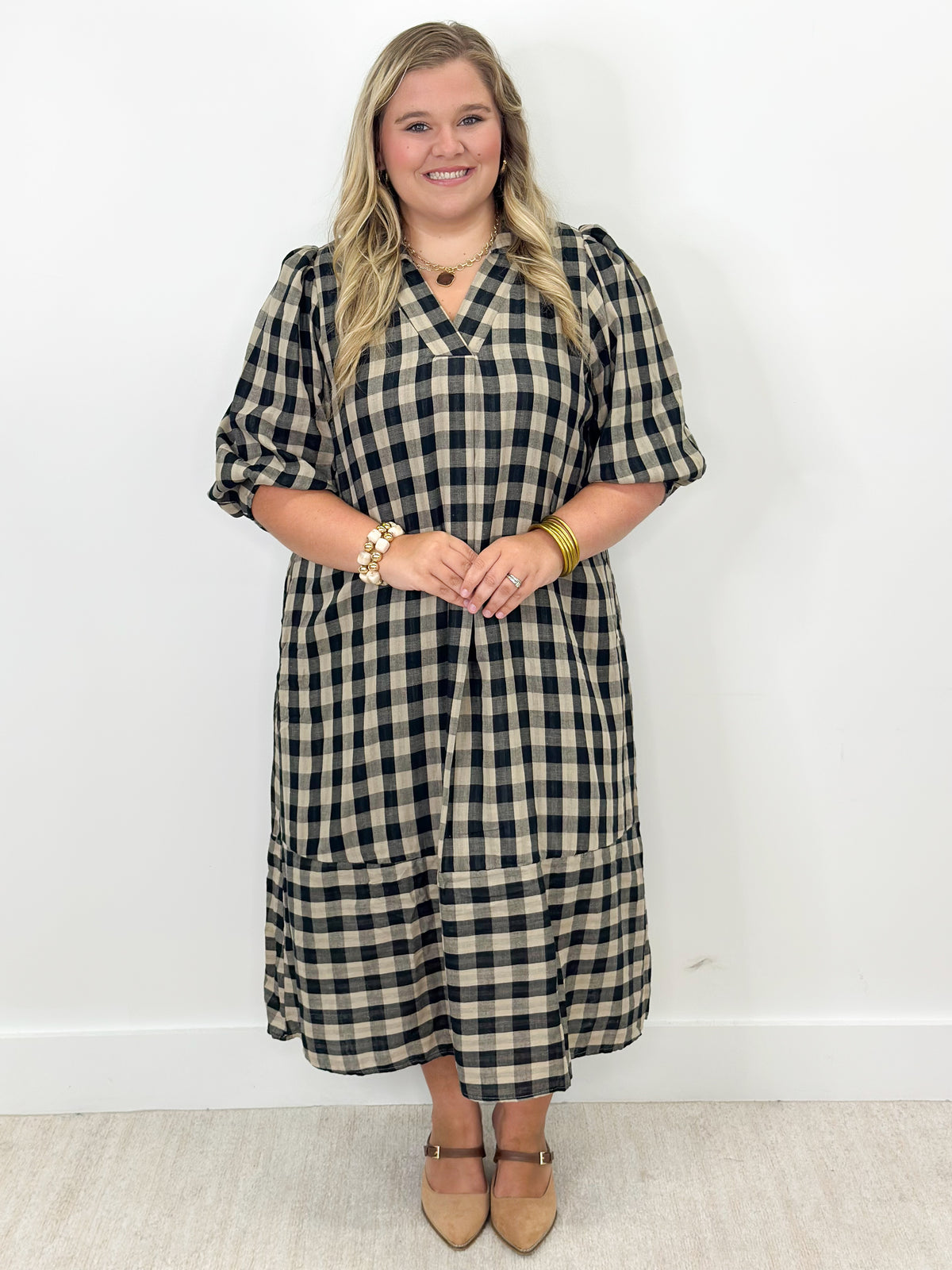 Navy and cream checkered midi dress with open collar, button front, short puff sleeves