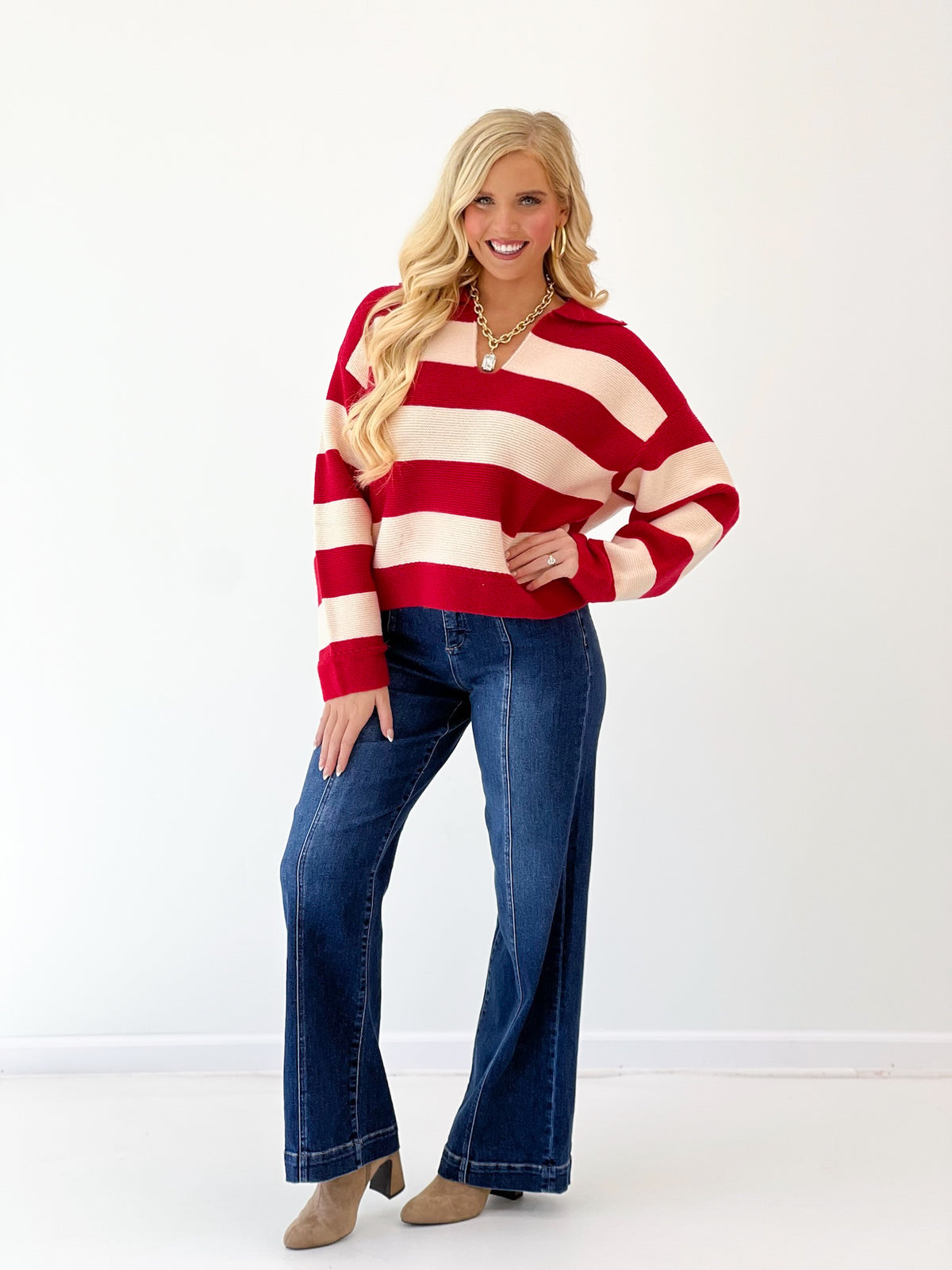 Red and ivory striped V-neck sweater with wide horizontal stripes