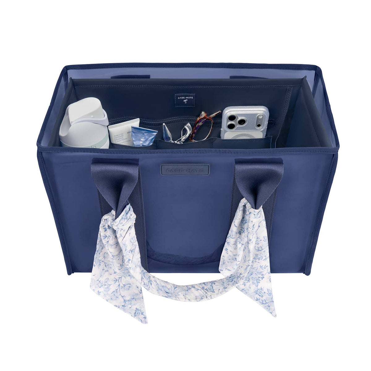 Navy tote organizer with front pocket panel, bow ties, and open interior