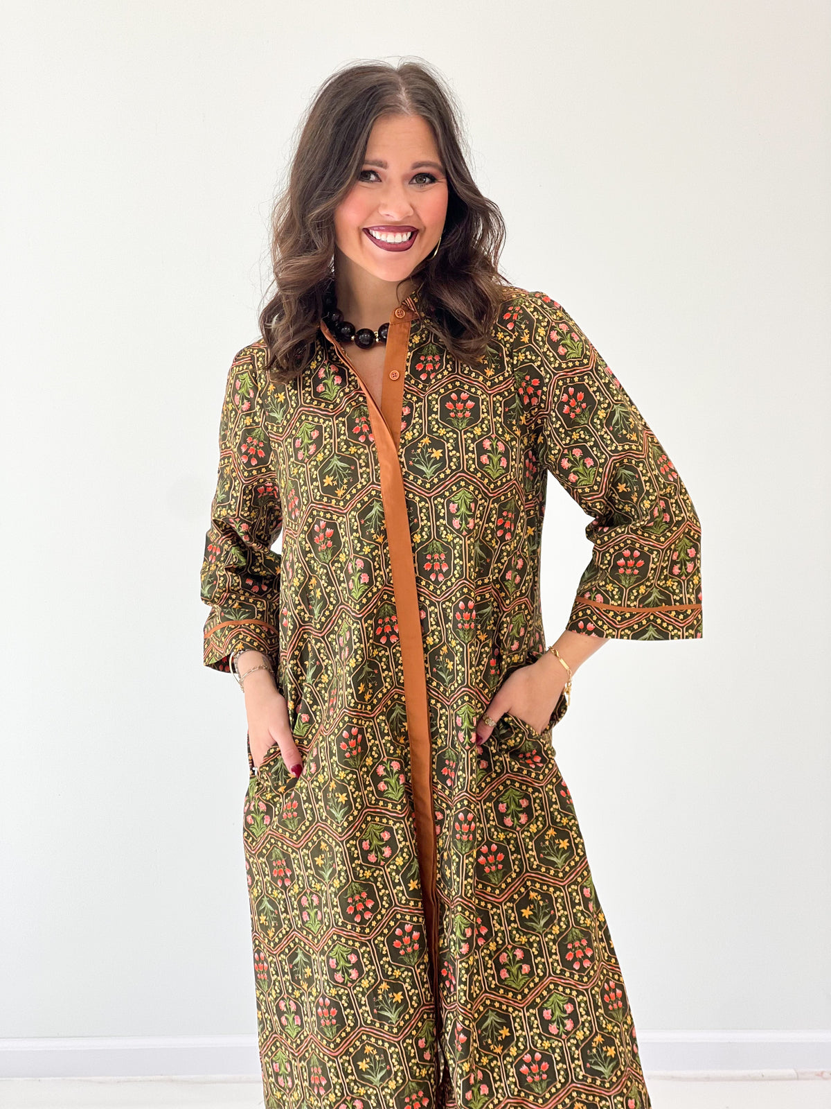 Olive floral midi dress with contrast button front placket and long sleeves