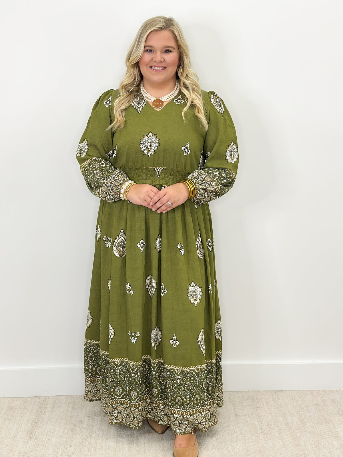 Olive green long-sleeve border print dress, lace-trim V neckline, gathered waist