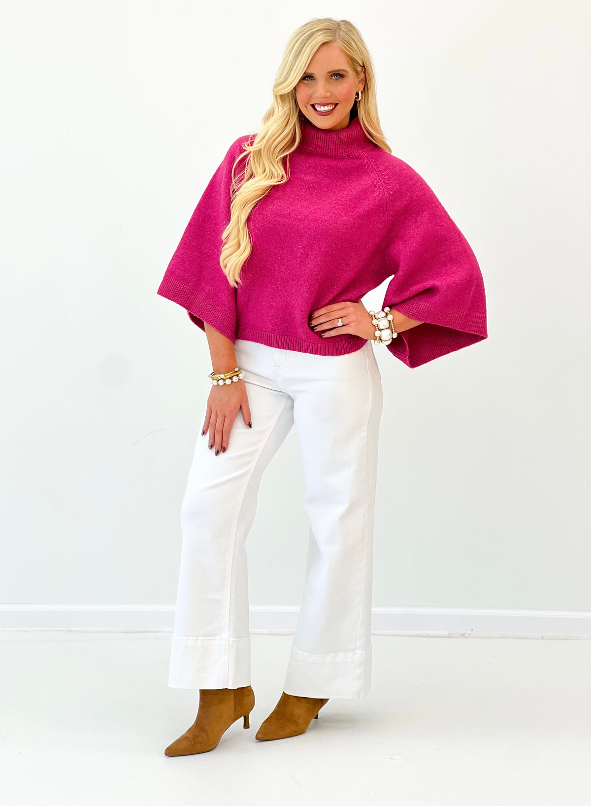 Fuchsia pink mock neck sweater with wide sleeves and ribbed neckline