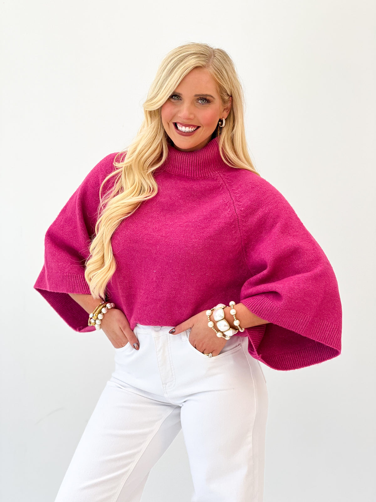 Fuchsia pink wide-sleeve mock neck knit sweater with ribbed collar