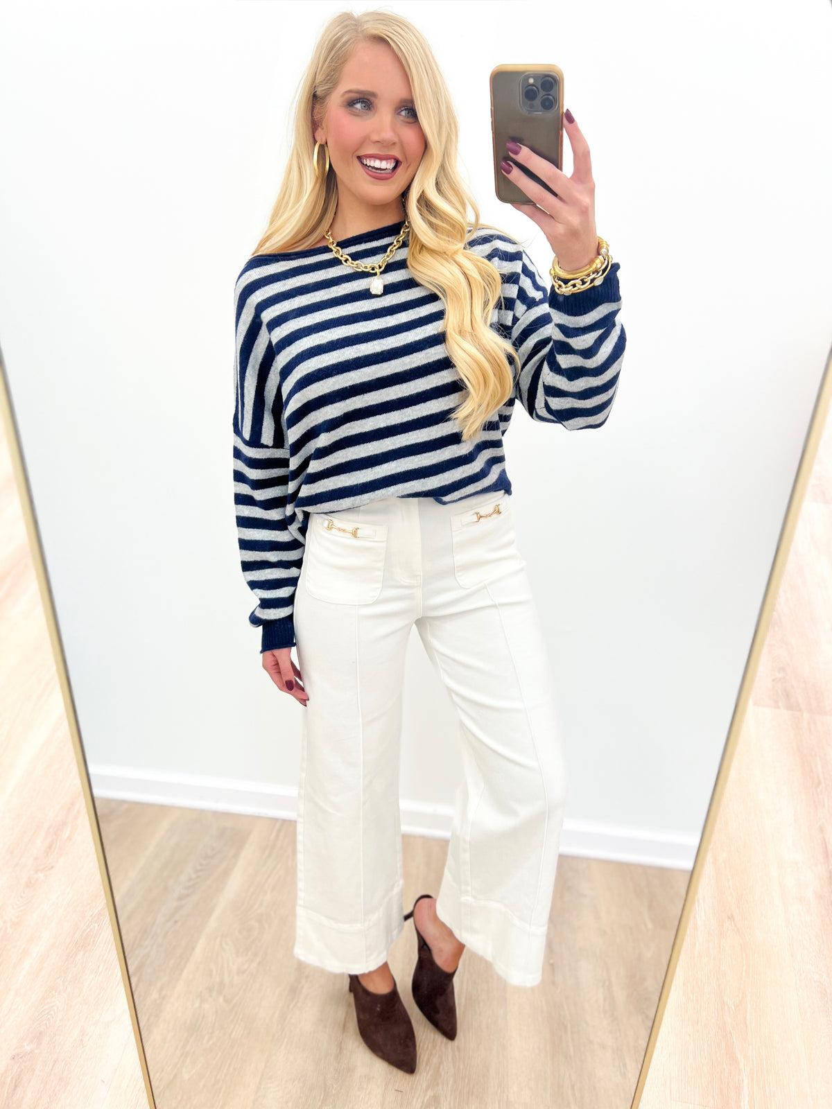 Navy and white striped off-shoulder sweater with long sleeves