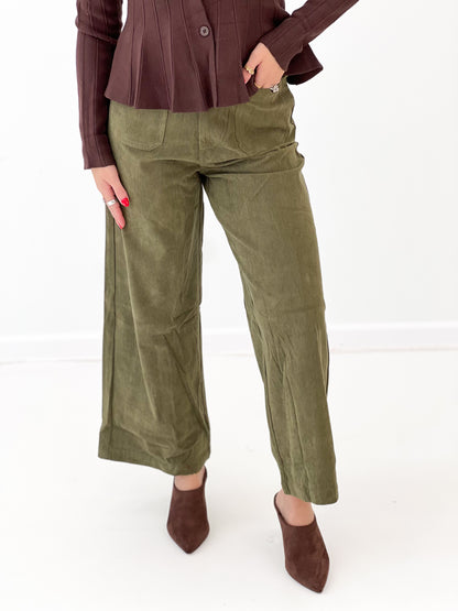 Olive corduroy wide-leg pants, side view with tapered wide-leg and pockets