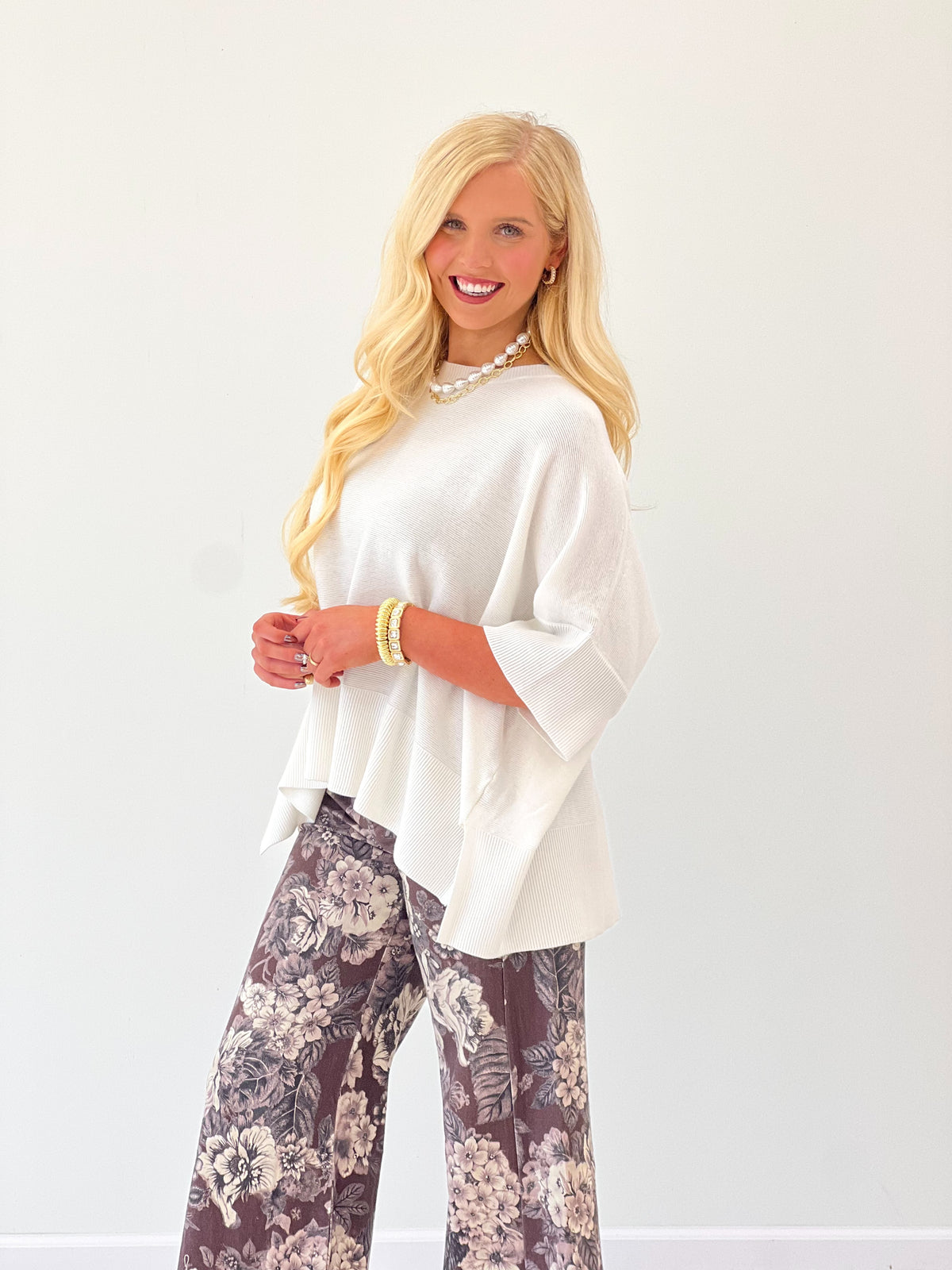 Ivory oversized round-neck pullover sweater with loose fit and dropped-shoulder sleeves