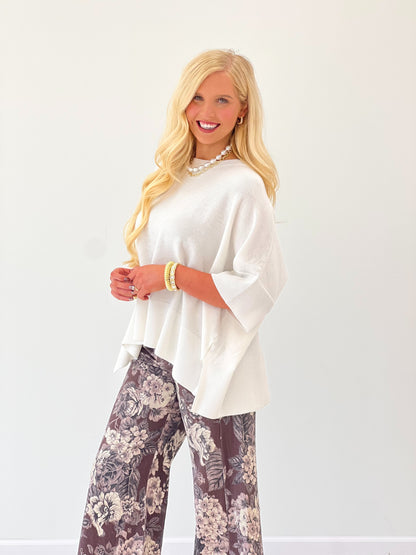 Ivory oversized round-neck pullover sweater with loose fit and dropped-shoulder sleeves