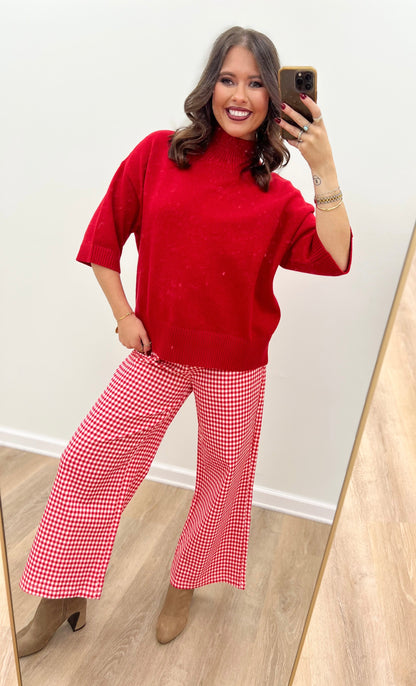 Red mock neck short-sleeve sweater with loose knit texture