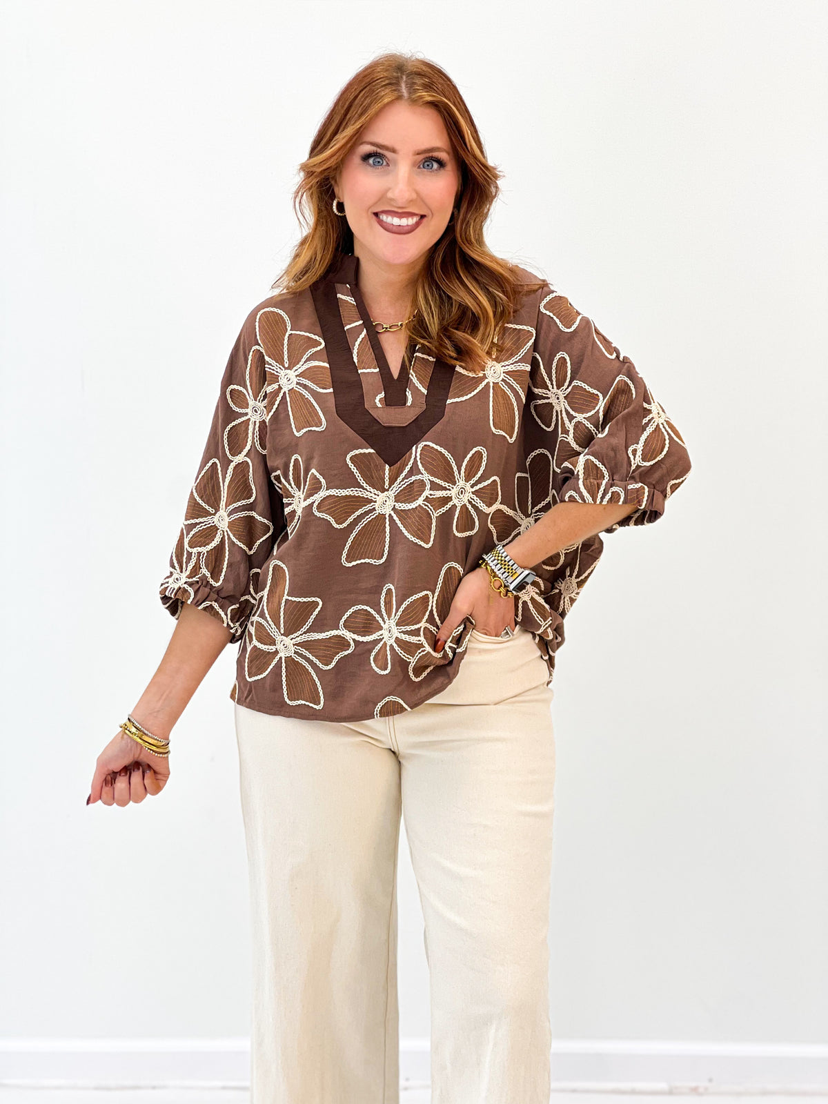 Mocha floral embroidered split-neck blouse with dolman-style sleeves and relaxed hem