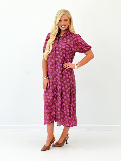 Magenta printed midi button-down dress, side view, ruffled collar and puff sleeves