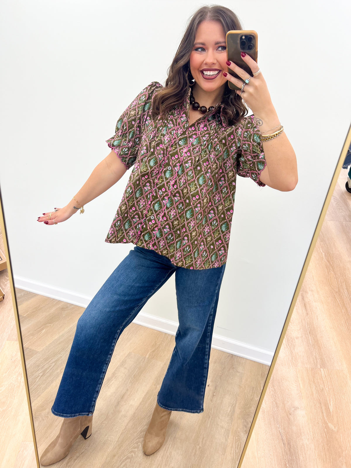 Floral pintuck puff-sleeve V-neck top in a multicolor print on a dark base
