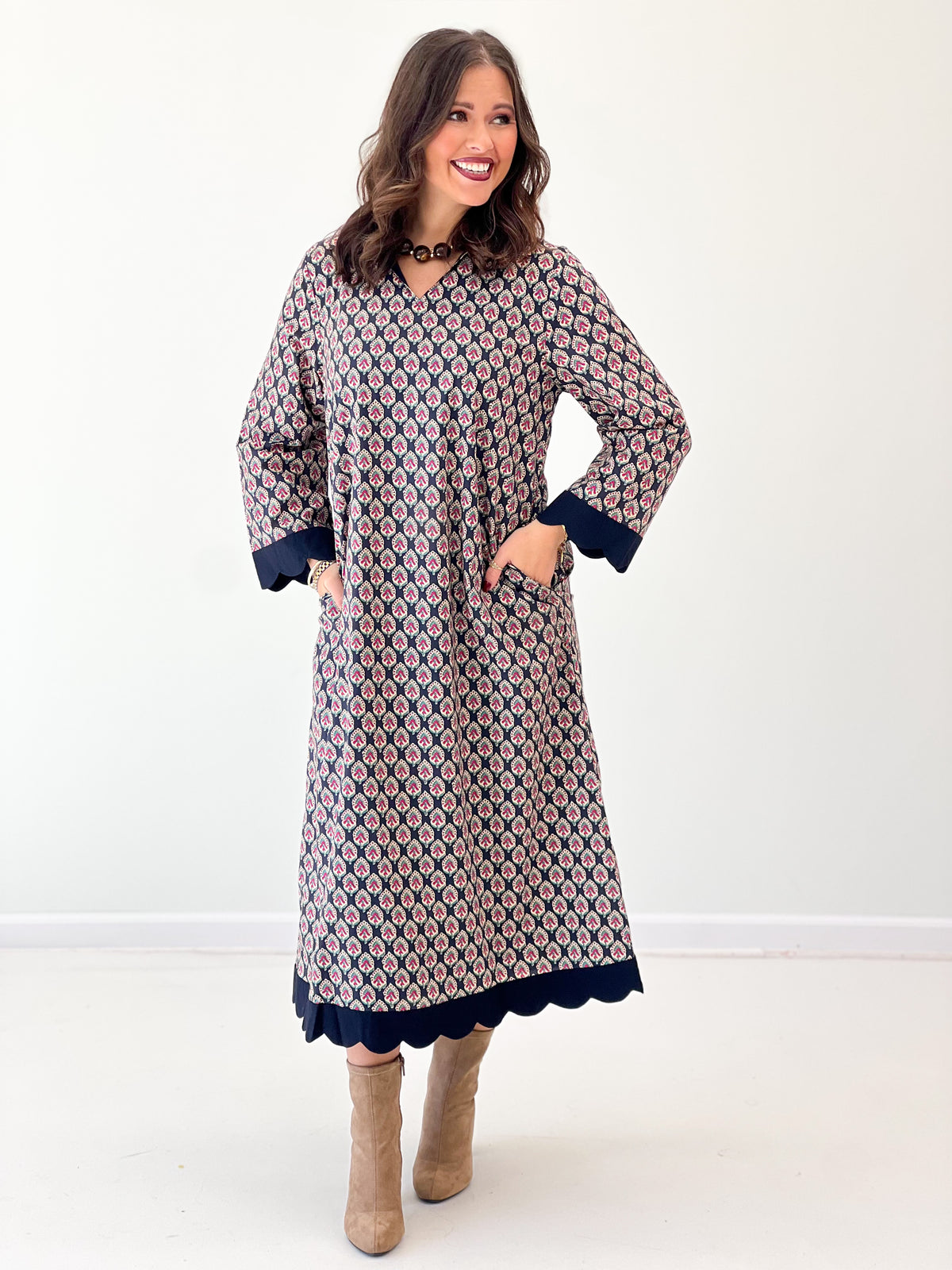 Navy floral V-neck maxi dress full front view with long sleeves and scalloped hem edge