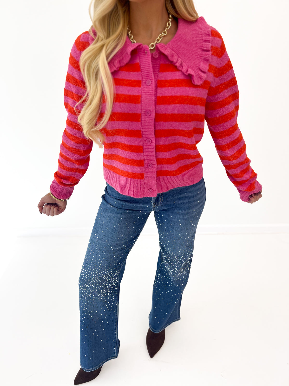 Hot pink striped sweater cardigan with ruffled collar, button-front and long sleeves