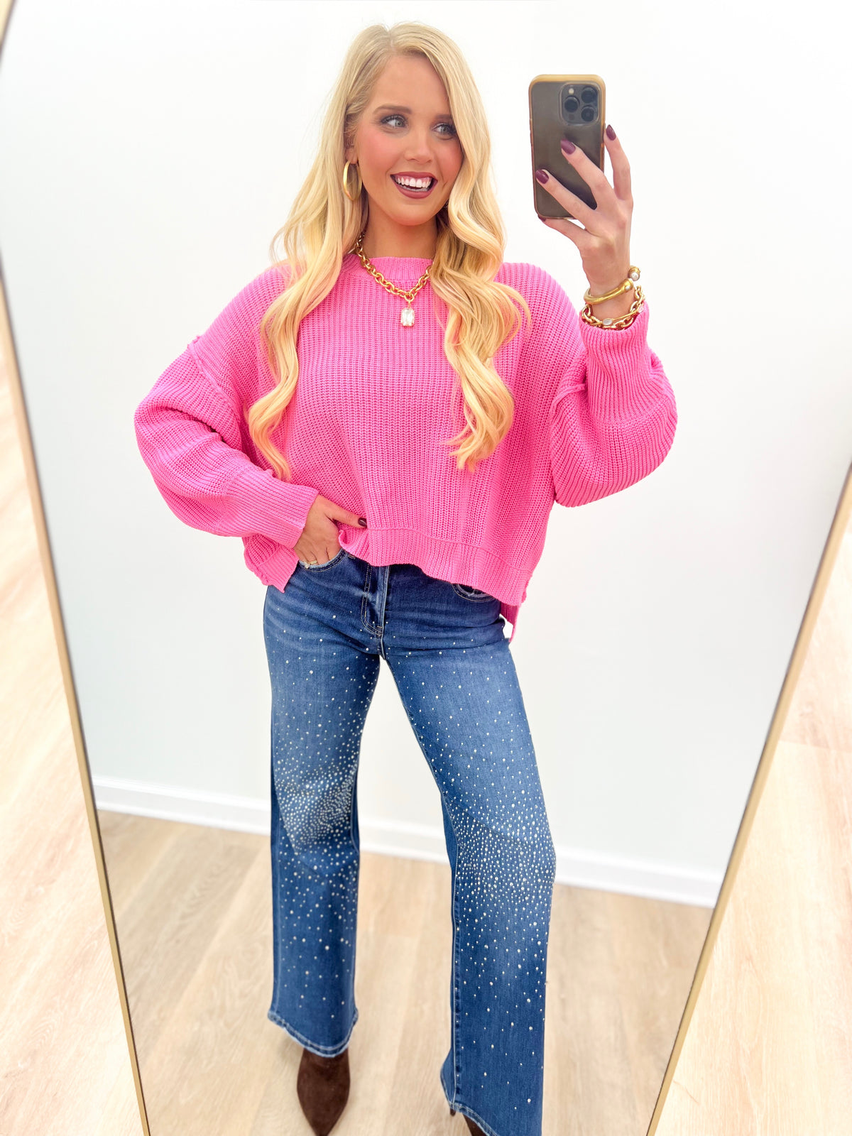 Pink oversized mock-neck sweater with ribbed cuffs and cropped look