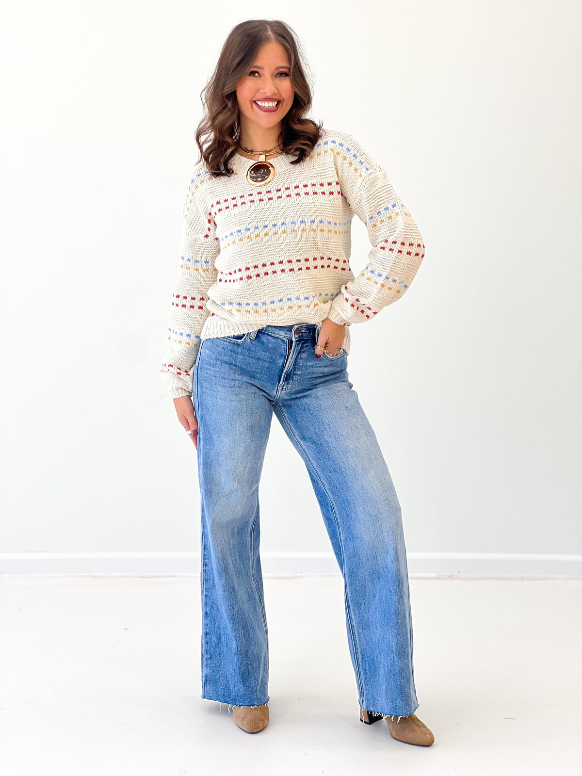 Cream striped long-sleeve sweater with crew neck, multicolor horizontal band pattern