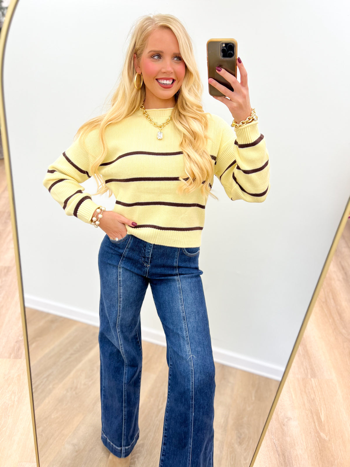 Buttery yellow striped crew neck long sleeve sweater with dark horizontal bands