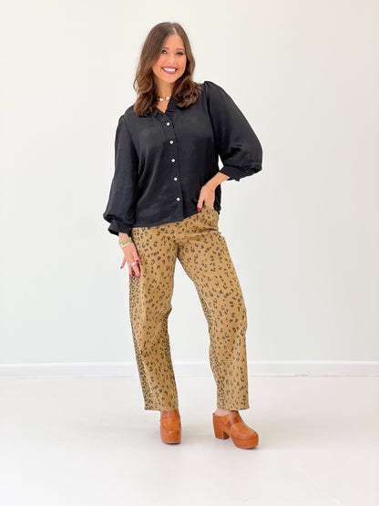 Black V-neck button-front top with puff bubble sleeves