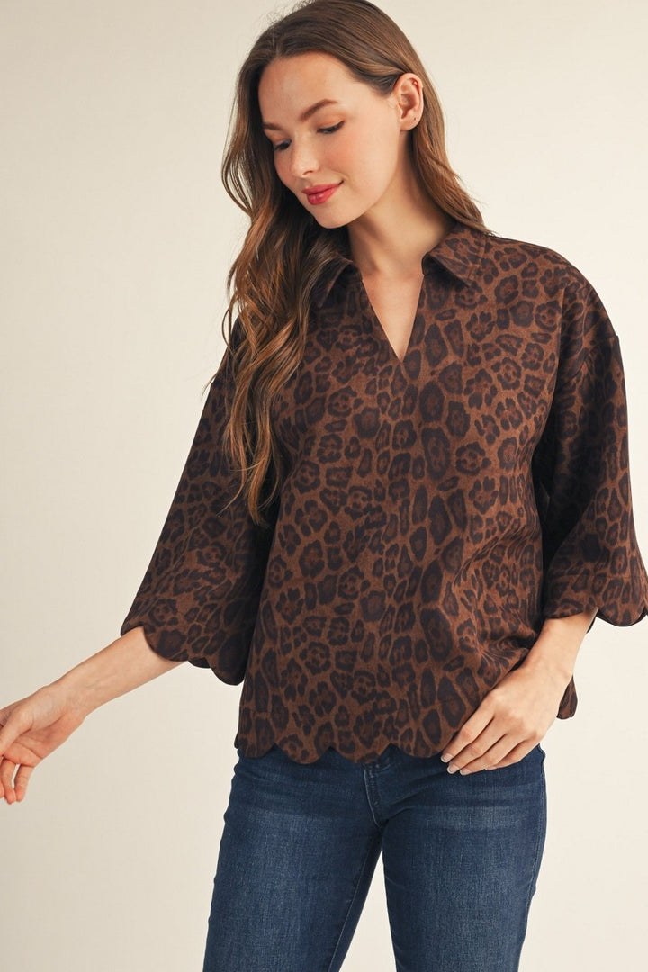 Leopard-print suede button-up top with scalloped hem and three-quarter sleeves (front view)