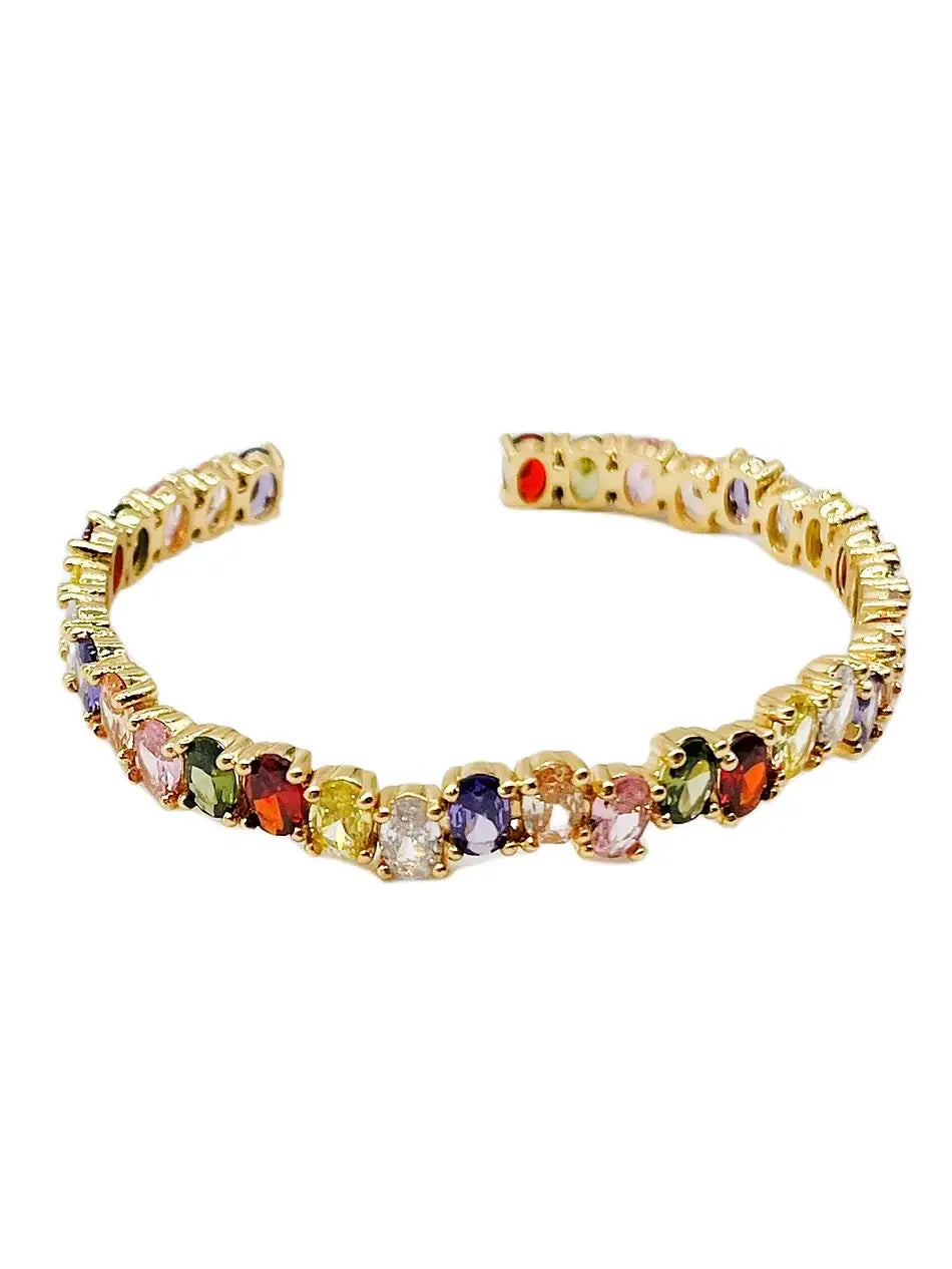 Gold-tone bangle with multicolor gemstone row and small prong settings
