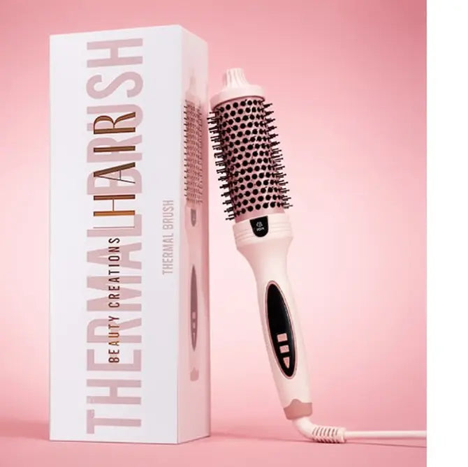 Beauty Creations thermal brush with rose gold barrel, bristles, controls and power cord beside box
