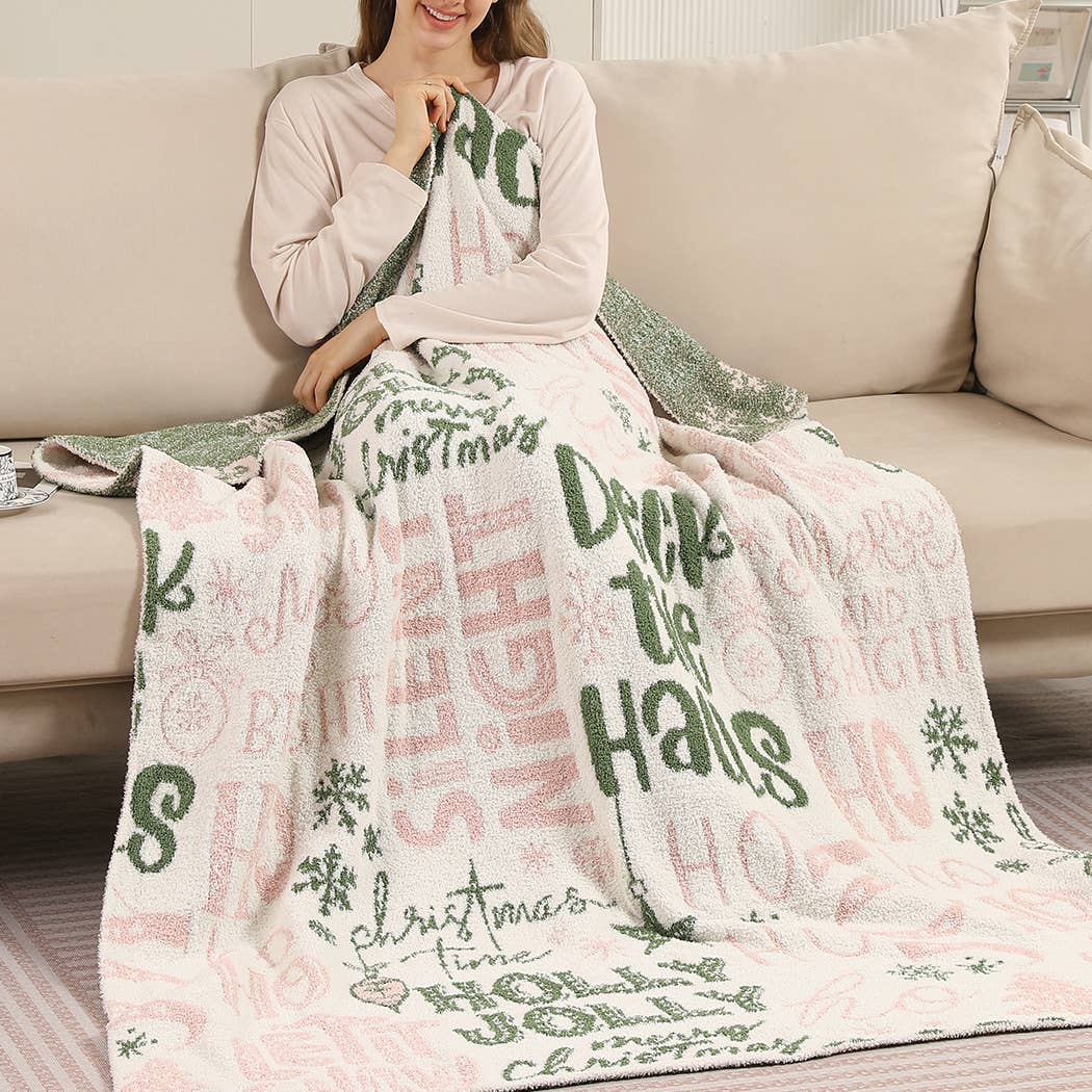 Cream throw blanket with pink and green Holly Jolly print
