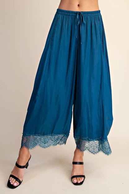 Teal cropped wide leg pants with lace hem and drawstring waist, front view