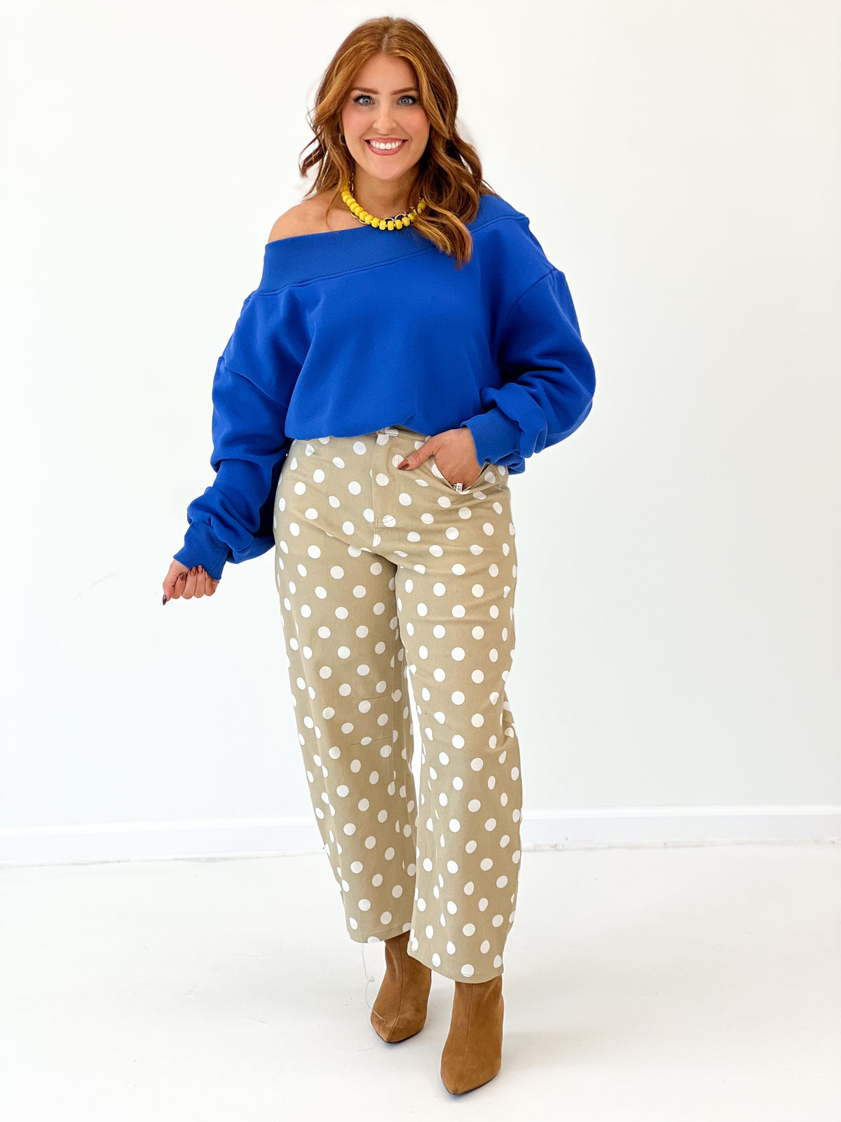 Taupe high-rise straight-leg polka dot pants with white dots, front view