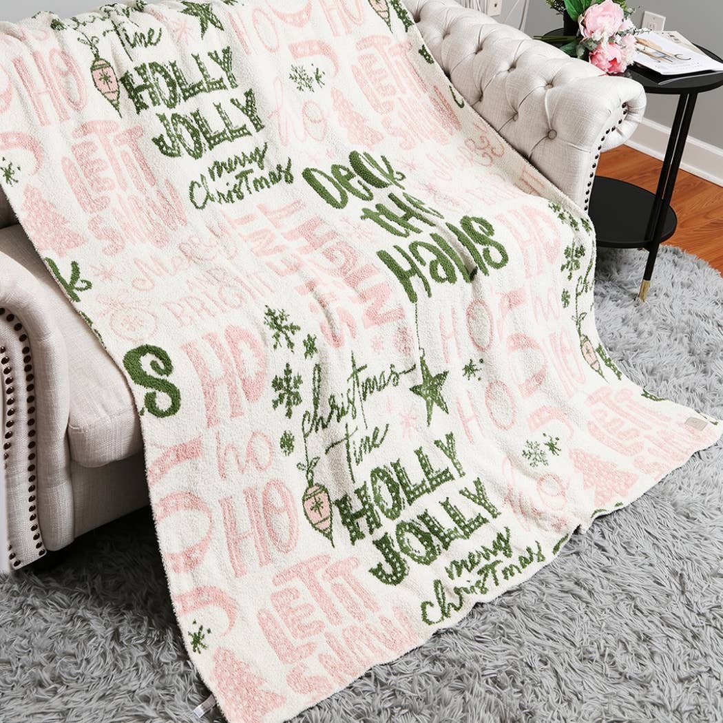 Cream throw blanket with pink and green Holly Jolly print