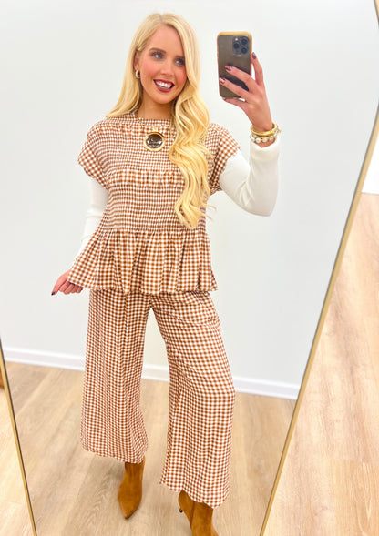 Red and white gingham wide-leg pants with smocked waist and tiered bib-like front