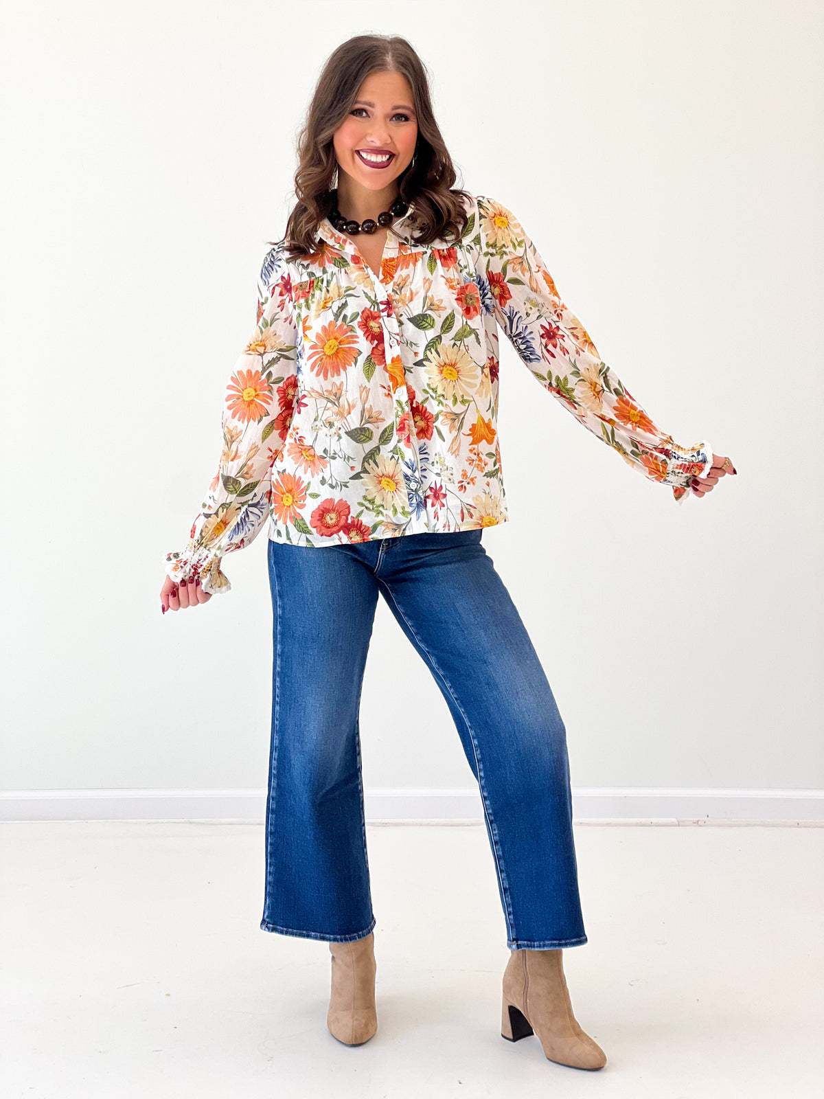 Floral print long-sleeve button-front blouse with lace trim, off-white base and colorful blooms