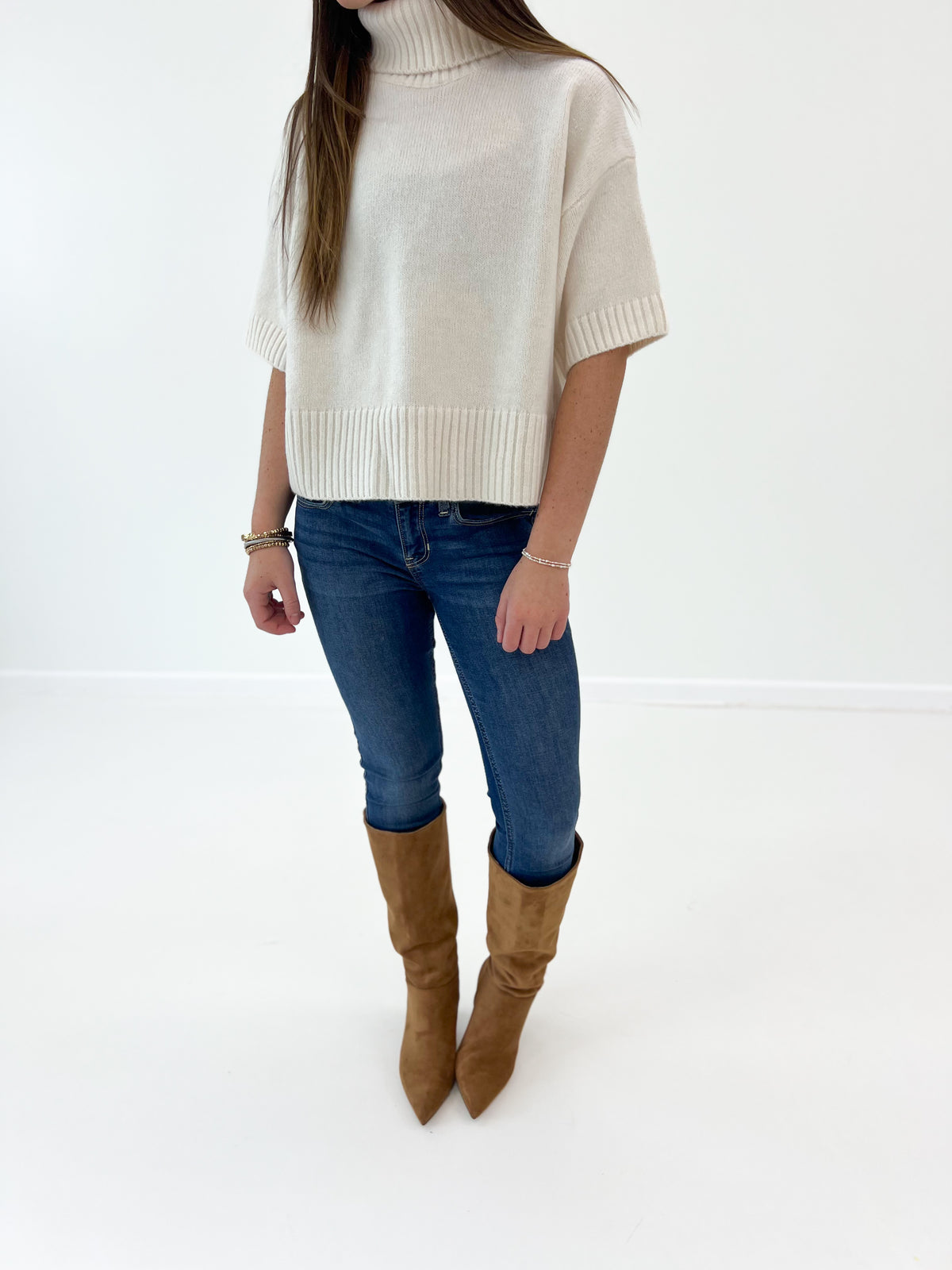 Off-white short-sleeve turtleneck knit sweater, cropped torso view