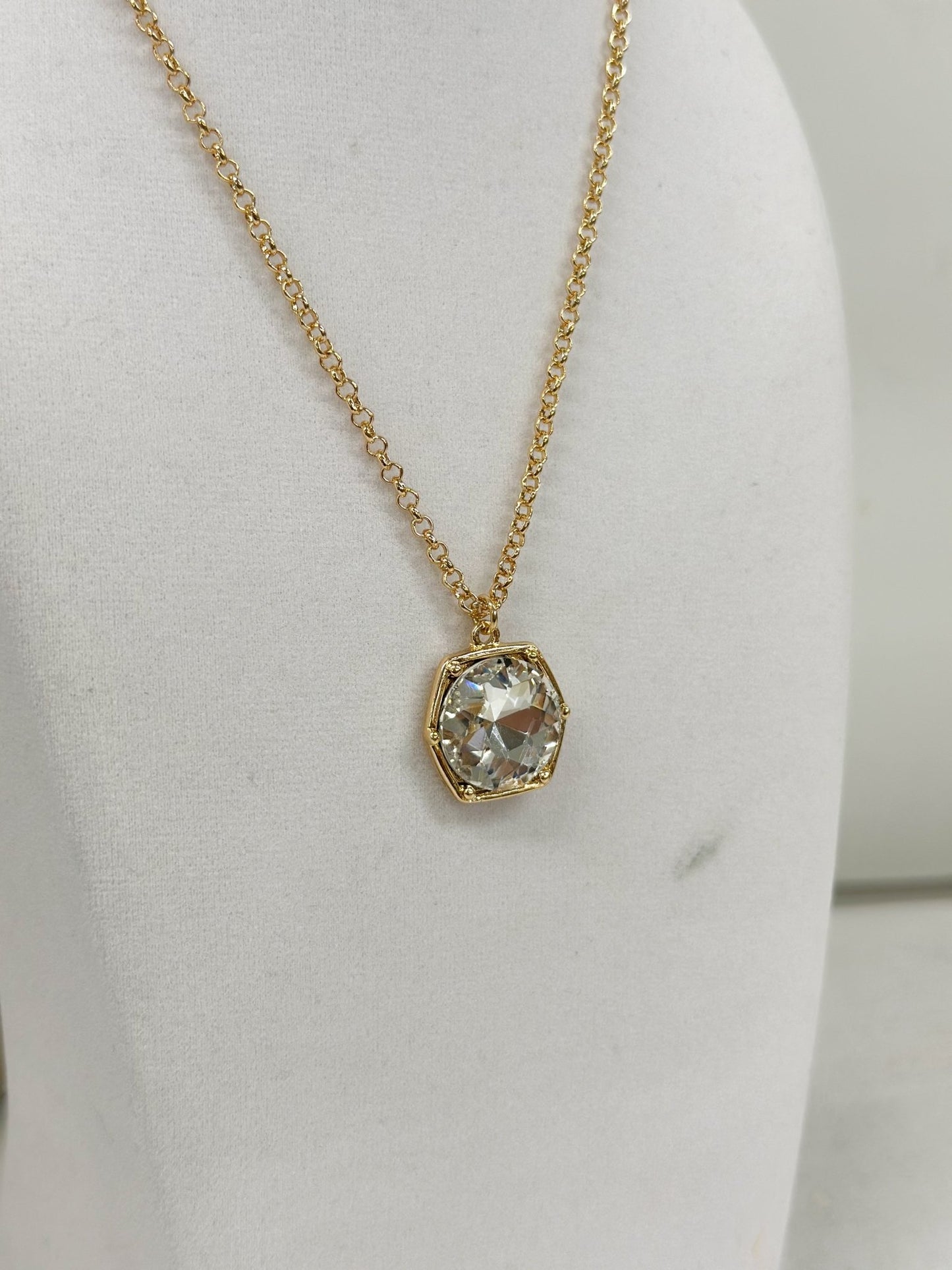 Clear glass hexagon stones linked along a necklace