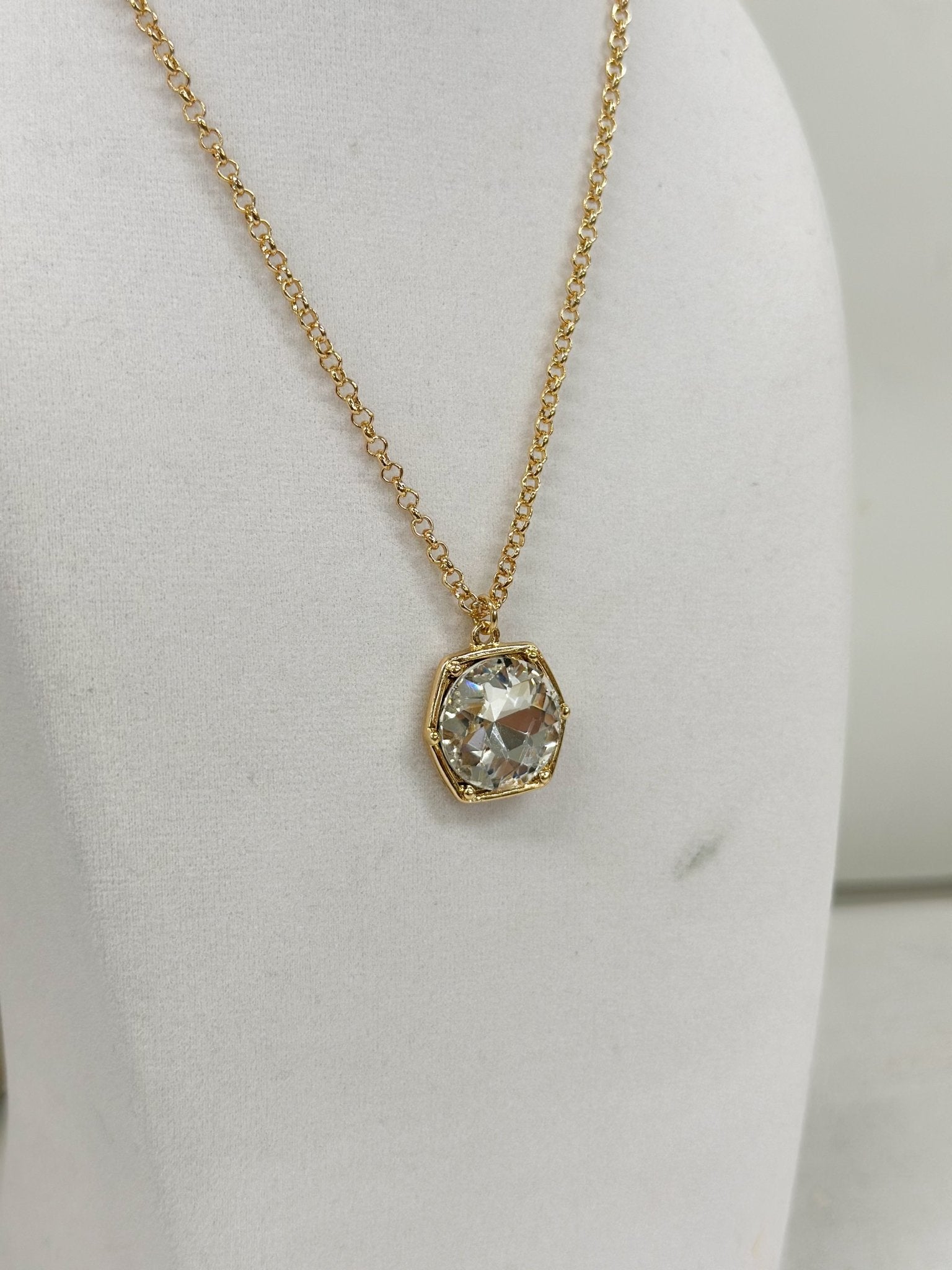 Clear glass hexagon stones linked along a necklace