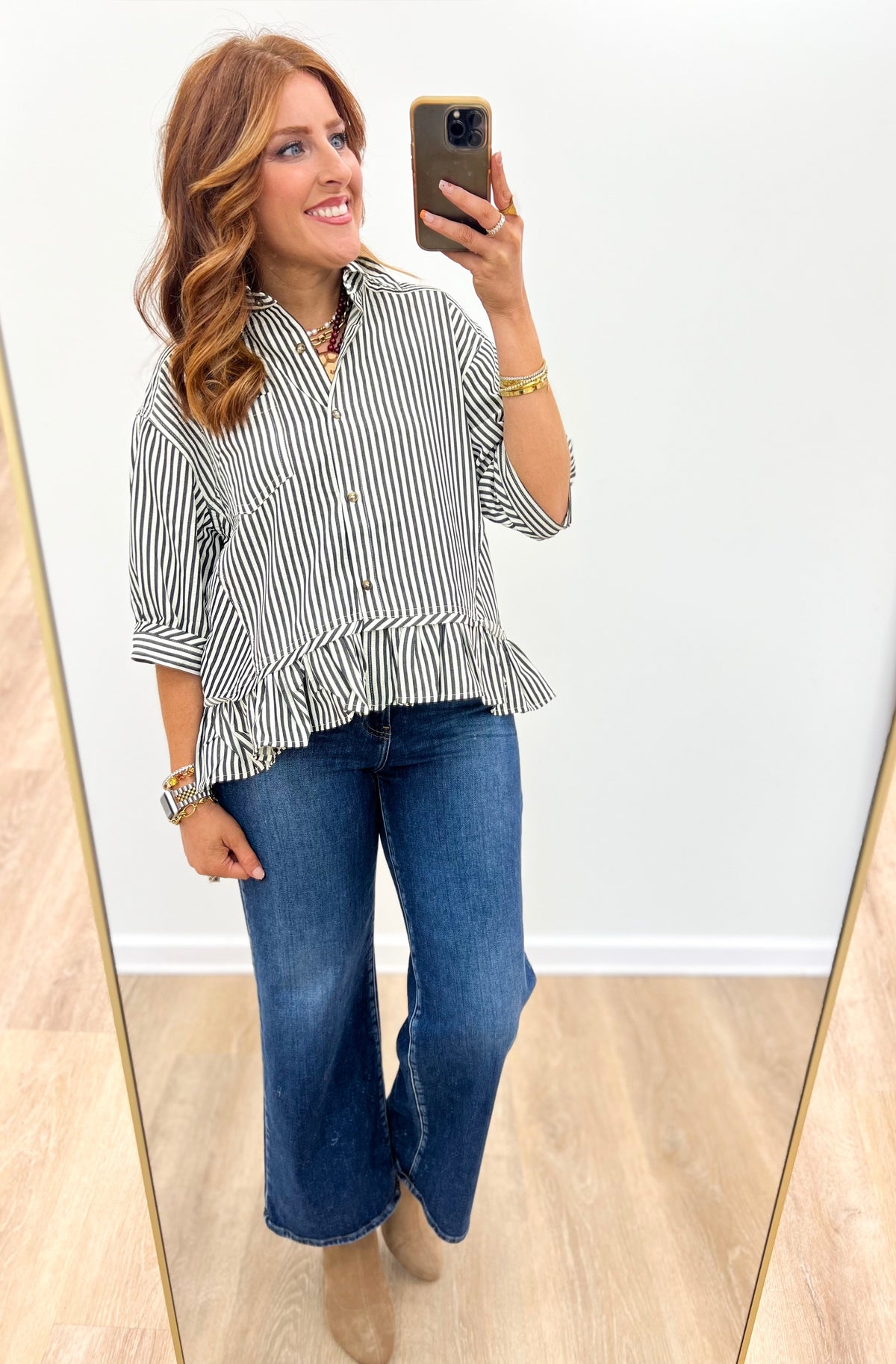 Striped peplum blouse with button front and layered peplum hem detail