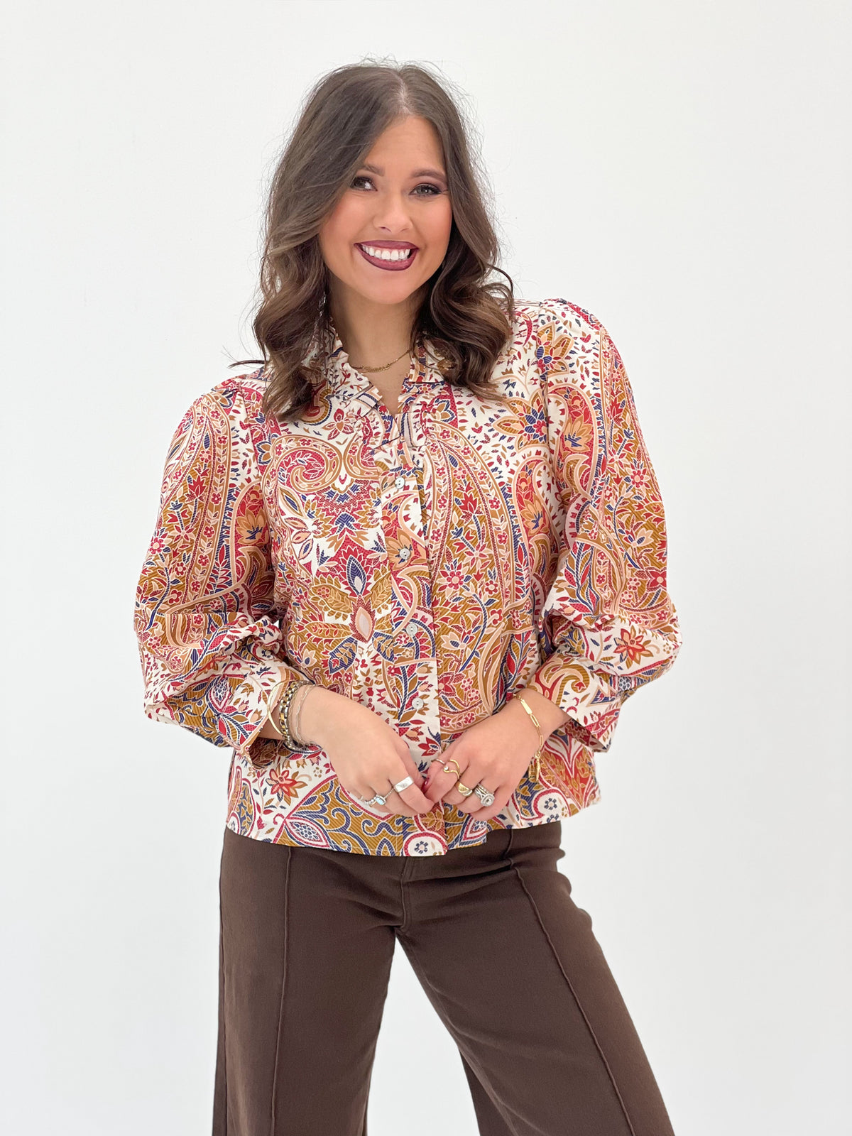 Cream floral ruffle-neck button-down blouse with long puff sleeves