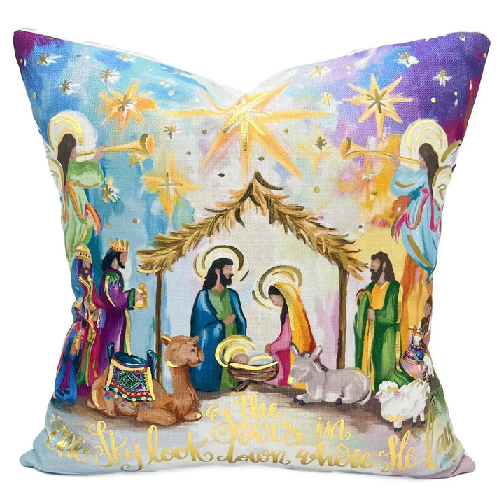Velvet nativity pillow with colorful illustrated scene and gold foil stars