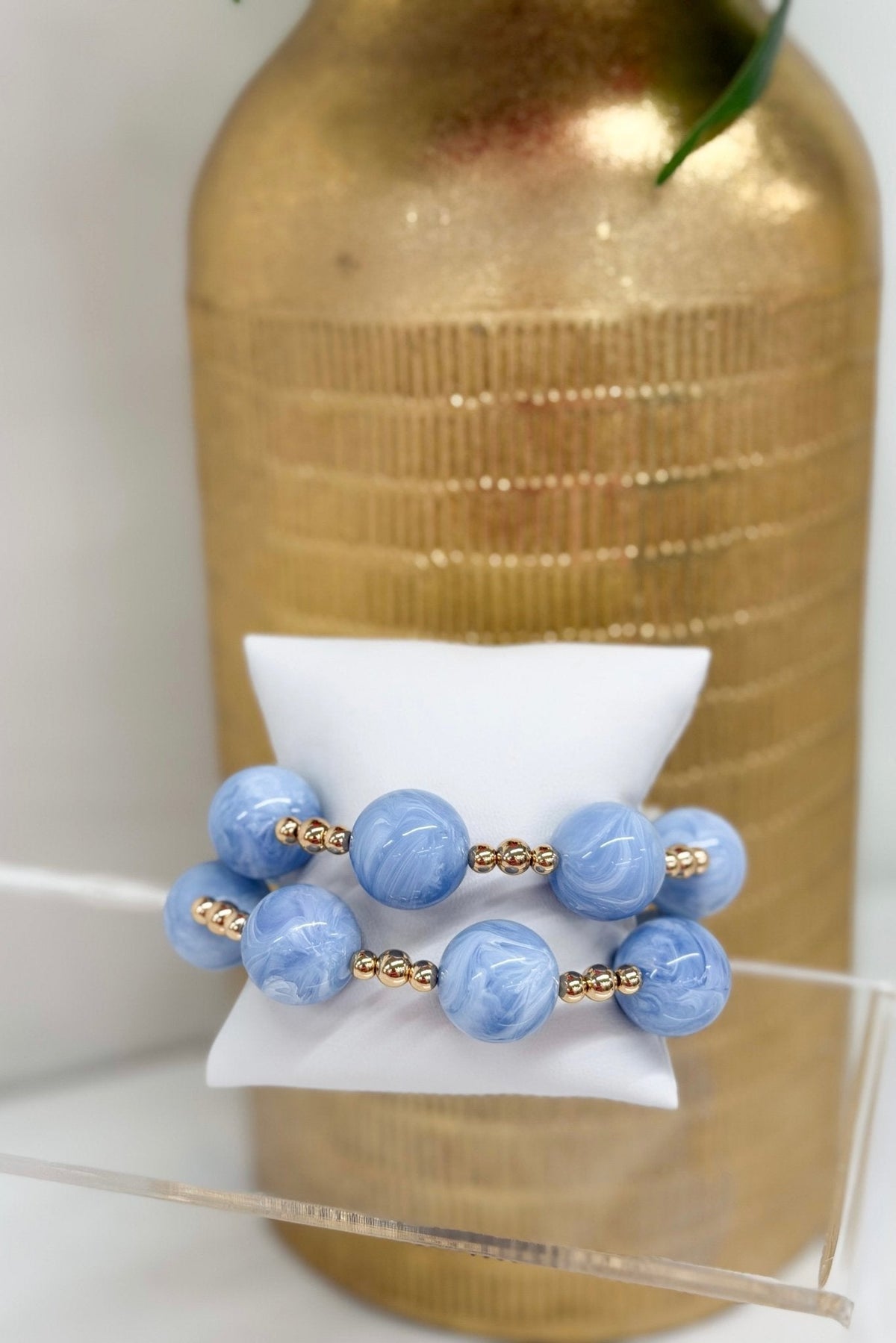 Marble ball beads in two rows with gold accents