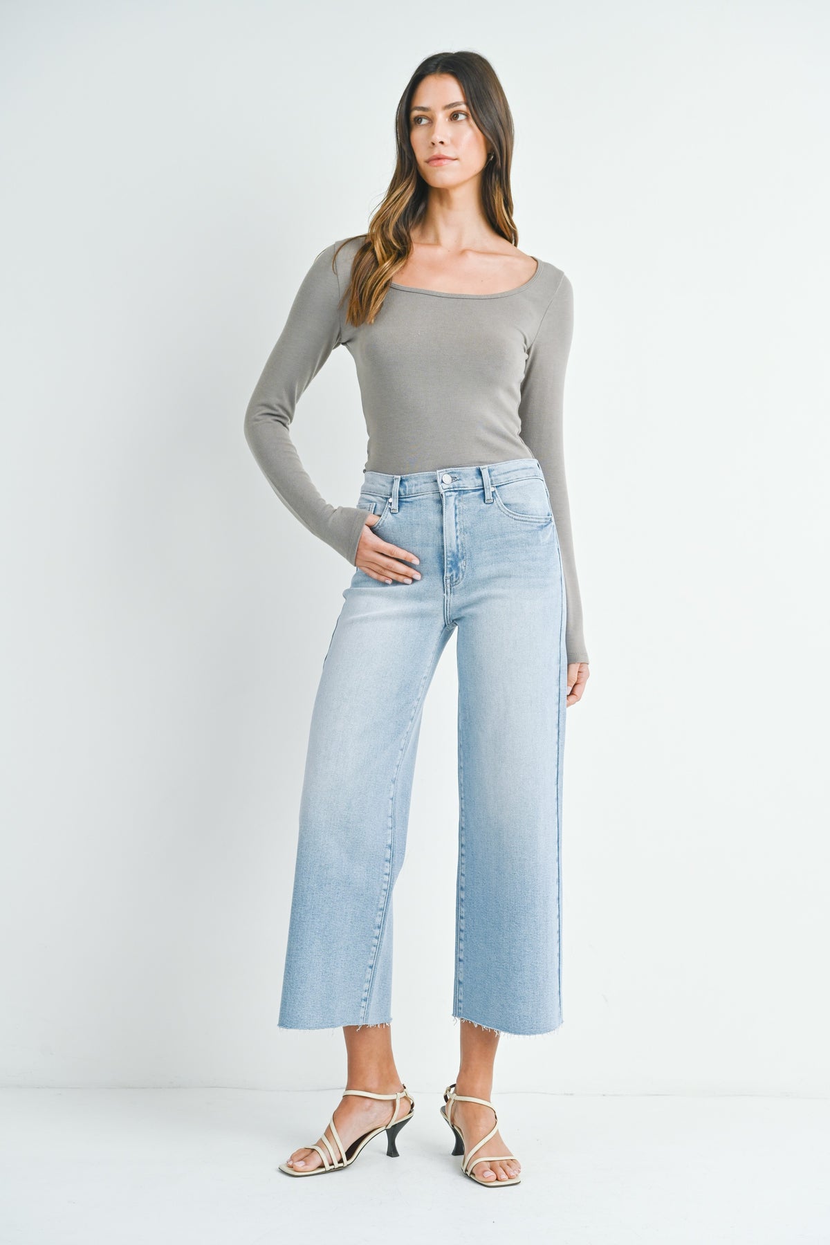 Light denim scissor cut wide leg jeans with a raw hem