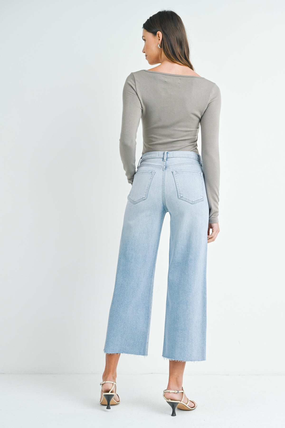 Light denim wide leg jeans with a scissor cut hem
