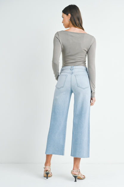 Light denim wide leg jeans with a scissor cut hem