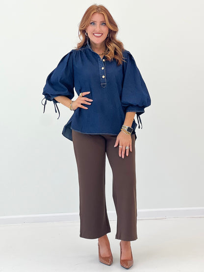 Dark denim henley-style top with gathered puff sleeves