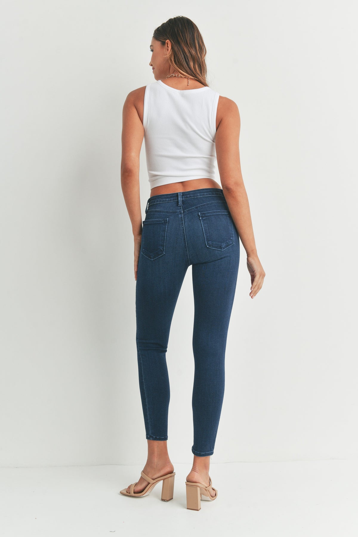 Dark wash stretch denim ankle skinny jeans
