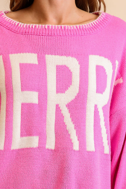 Timing Merry Festive And Chic Holiday Sweater in Pink, styled with denim shorts