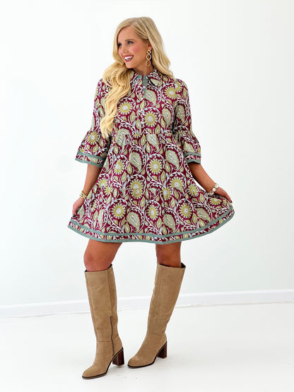 Wine paisley button-up dress with teal-trimmed sleeves and gathered, flared skirt